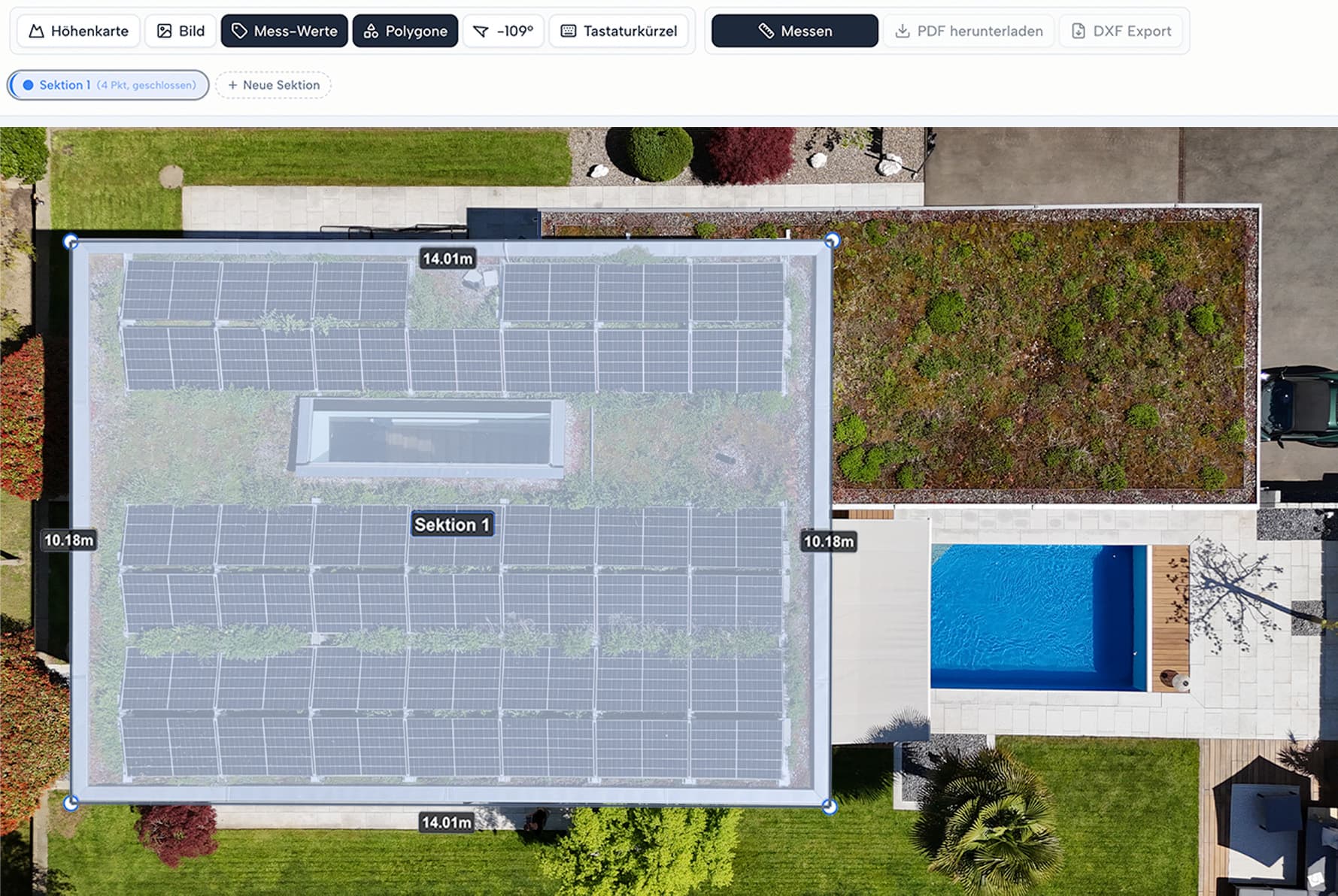 Top-down drone shot of a Swiss single-family home with photovoltaics, green roof and pool